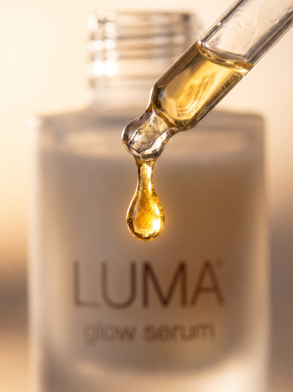 Macro shot of a golden serum drop